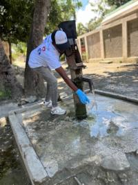 man at well