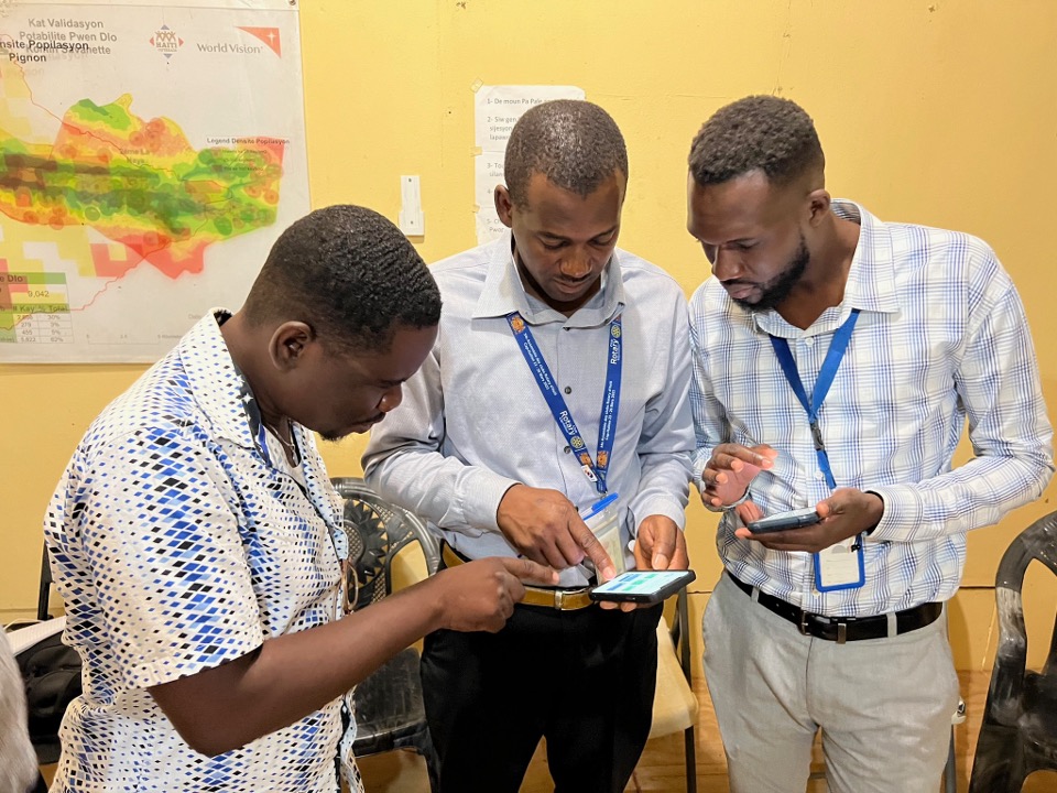 Four men reviewing the details for the Pignon Water System Service