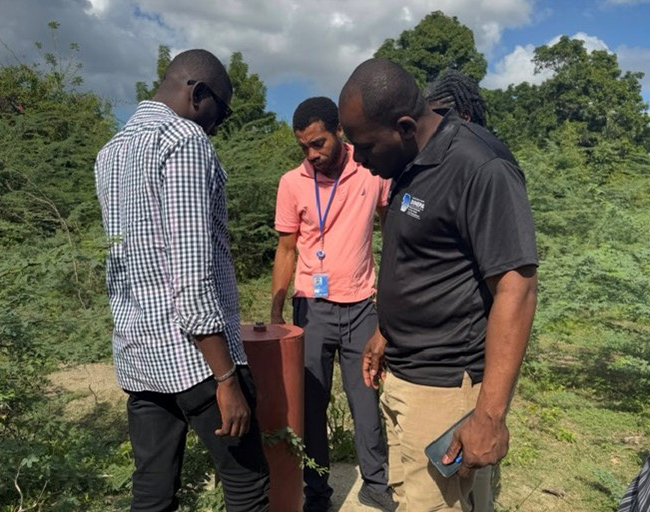 Cap-Haitien members reviewing a new Bore Hole